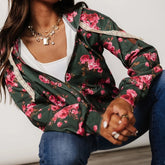 Person wearing a floral jacket with pink flowers